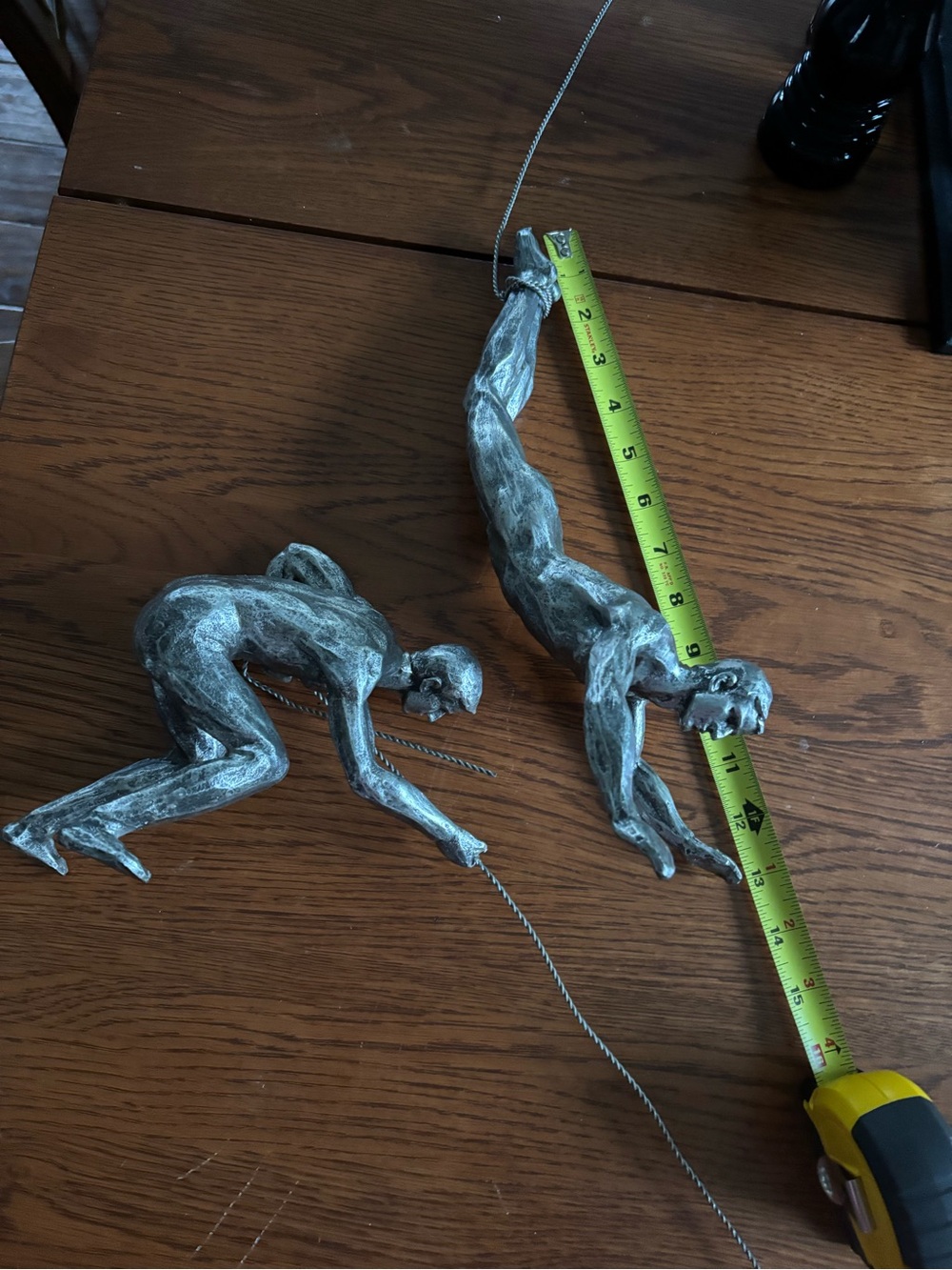 Set of Two Silver Climbing Wall Sculptures - Metal look figurines.